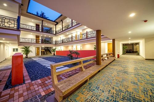 an empty lobby with benches in a building at Zhangjiajie Tianchong Yunhai Resort Hotel in Zhangjiajie