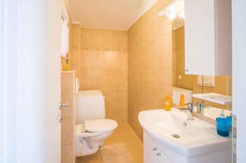 a bathroom with a white sink and a toilet at Holiday home in Vrbnik - Insel Krk 13634 in Vrbnik