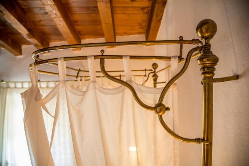 a lamp in a room with a curtain at Hotel Boutique Posada Dos Orillas in Trujillo