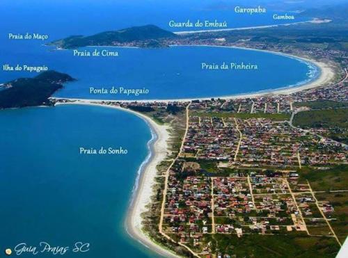 a map of a small island next to a beach at Apartamento moderno na praia da palhoça c garagem in Palhoça