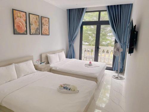 Ένα ή περισσότερα κρεβάτια σε δωμάτιο στο La Maison De Dino Grandworld