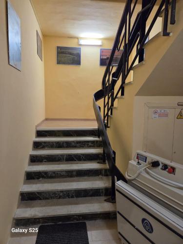 a staircase in a building with a stair case at Giappone Inn Flat in Livorno
