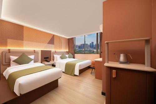 Ένα ή περισσότερα κρεβάτια σε δωμάτιο στο A Hotel Farrer Park - Newly Renovated