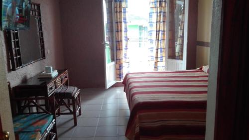 Katil atau katil-katil dalam bilik di Hotel Angela Carolina