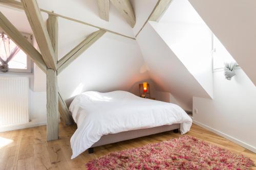 Giường trong phòng chung tại Les Appartements Saint Nicolas