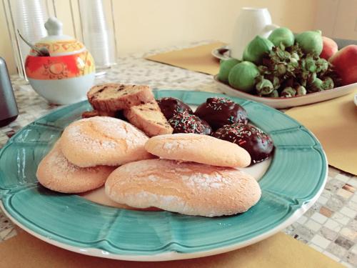 a plate of donuts on a table at B&B S. Teresa in Altamura