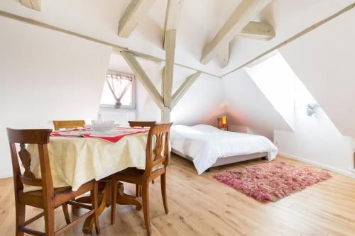 Giường trong phòng chung tại Les Appartements Saint Nicolas