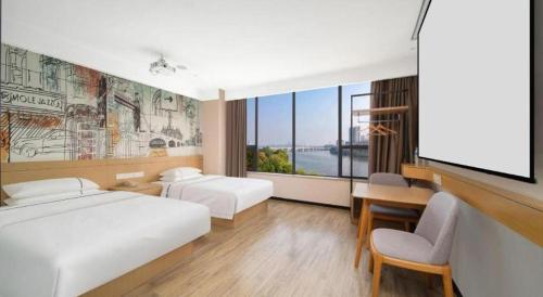 Postel nebo postele na pokoji v ubytování City Comfort Inn Huangshi Yangxin Mingyuewan Park