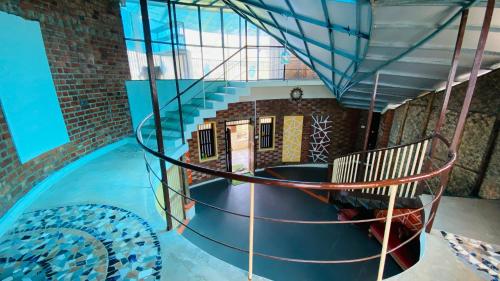 a view of a spiral staircase in a building at Nirvikalpa vagamon in Vagamon