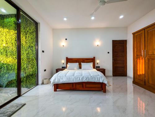Postel nebo postele na pokoji v ubytování The Green Homestay - Galle