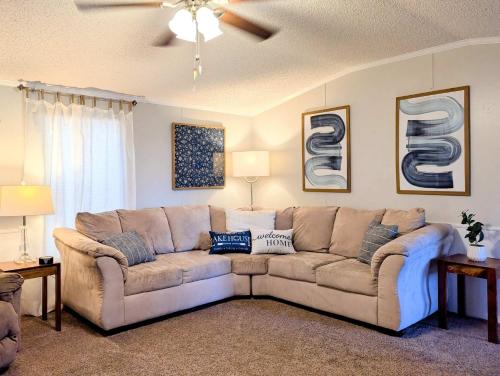 a living room with a large couch in a room at Rough River Lake Cabin Fishing in Fentress McMahan