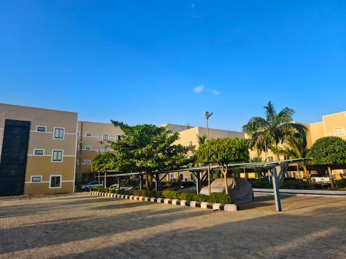 a person laying on the ground in a parking lot at Jun Yue 9 Hotel Kano in Kano