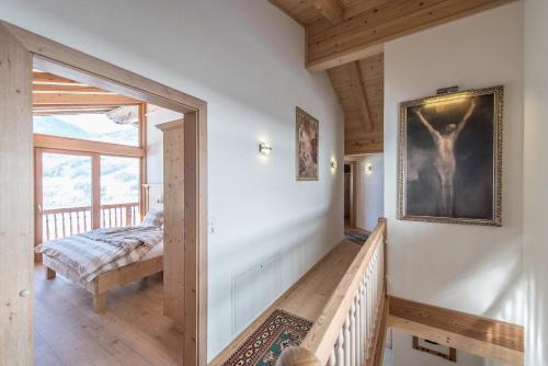 a hallway with a stairway leading to a bedroom at Logenplatz Zillertal in Ramsau im Zillertal