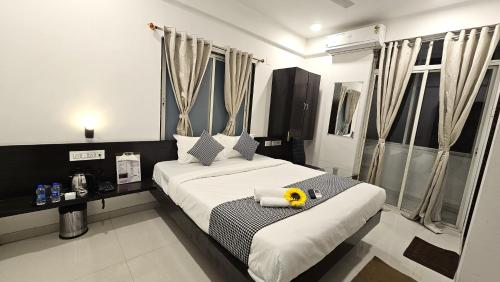 Ένα ή περισσότερα κρεβάτια σε δωμάτιο στο Basil Inn