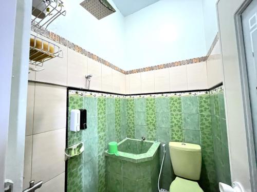 Ένα μπάνιο στο Homestay Syariah Jogja Dekat UII By Simply Homy