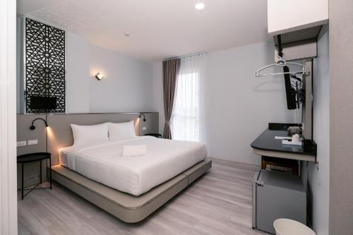 Ένα ή περισσότερα κρεβάτια σε δωμάτιο στο One Budget Hotel Chiangrai Maesai Payang