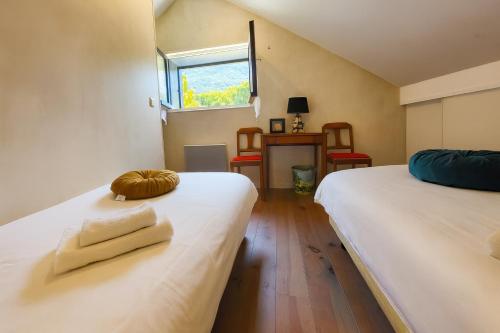 Postel nebo postele na pokoji v ubytování La Petite Maison de Barousse