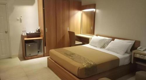 Postel nebo postele na pokoji v ubytování Grand Dian Hotel Slawi