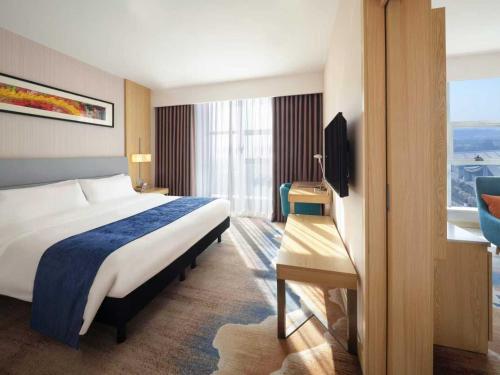 Ένα ή περισσότερα κρεβάτια σε δωμάτιο στο ibis Styles Changsha Intl Exhibition Ctr