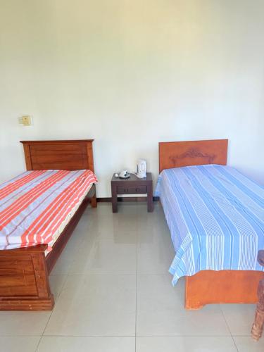 Postel nebo postele na pokoji v ubytování The White House