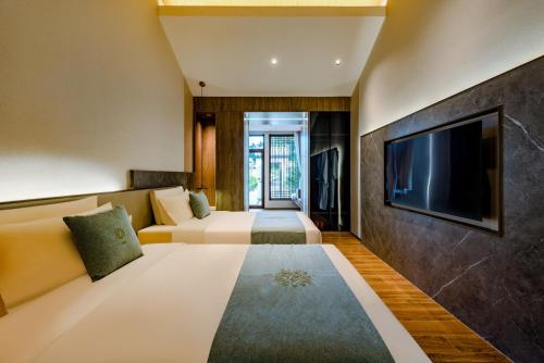 Ένα ή περισσότερα κρεβάτια σε δωμάτιο στο Huazhu Luxury Tai'an Lile and Xiyuan