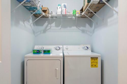 a kitchen with a white stove and a refrigerator at New to listing Dorsey Dock Retreat w Dock in Hartwell