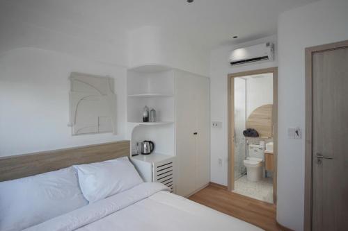 Postel nebo postele na pokoji v ubytování Adory Homestay Huế