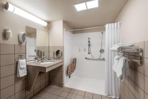 a bathroom with a shower and a sink at Hawthorn Suites by Wyndham Napa Valley in Napa