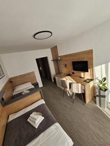 Postel nebo postele na pokoji v ubytování Hotel Flóra