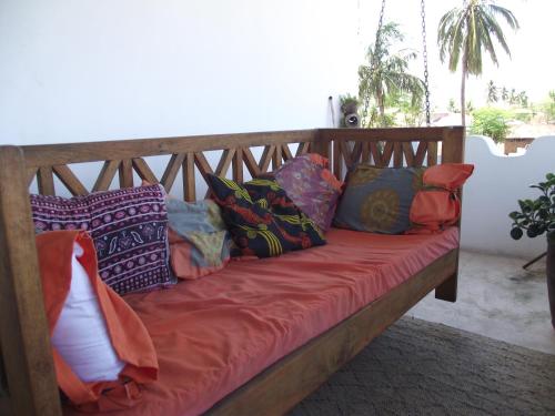 Ένα ή περισσότερα κρεβάτια σε δωμάτιο στο Ella's Swahili House