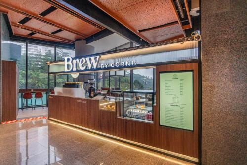 a restaurant with a sign that reads brew by convention at Antara Genting Highlands by COBNB - near Link Bridge in Genting Highlands