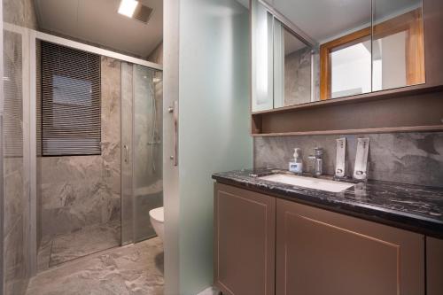 Ένα μπάνιο στο 来咖海景民宿酒店三亚湾海上大都会右岸店