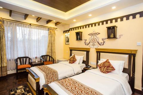 Postel nebo postele na pokoji v ubytování Hotel Encounter Nepal & Spa