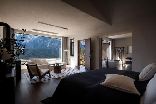 麗江市にある丽江玉龙漫椿雪山民宿のベッドルーム1室(ベッド1台付)が備わります。