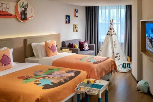 Postel nebo postele na pokoji v ubytování Changsha Huaxin Hotel