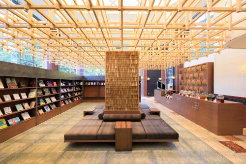 a library with a column in the middle of a room at Yutorelo Echigoyuzawa in Yuzawa