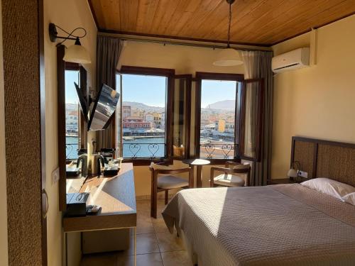 Ένα ή περισσότερα κρεβάτια σε δωμάτιο στο Ξενοδοχείο Έλενα