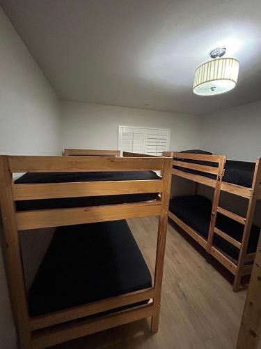 two bunk beds in a room with a ceiling at Santa Ana Vibes in Santa Ana