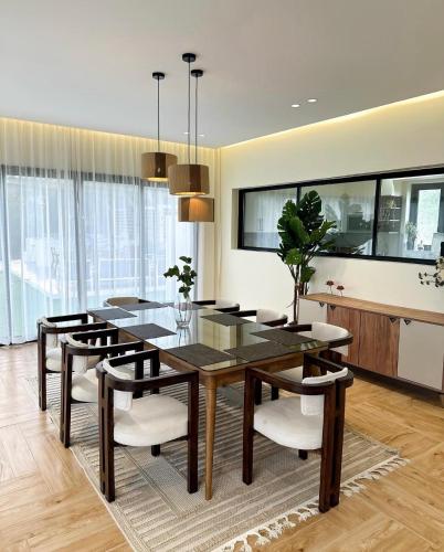 a dining room with a table and chairs at Hatta Valley Lodge in Hatta