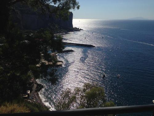 a view of the ocean from a cliff at B&B La Grotta Marina in Vico Equense