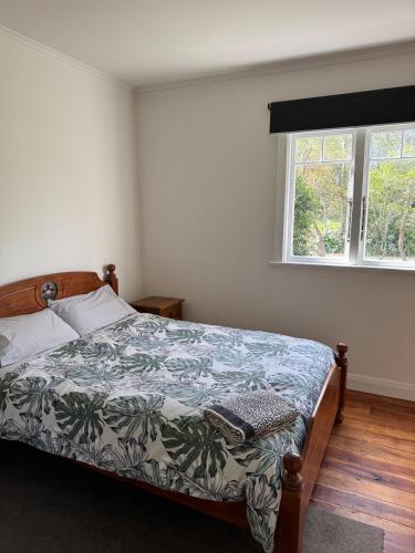 En eller flere senge i et værelse på Rato Retreat