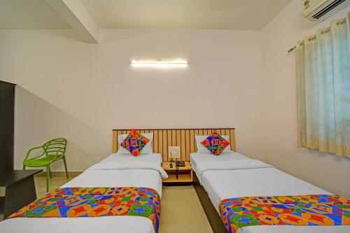 Ένα ή περισσότερα κρεβάτια σε δωμάτιο στο FabHotel Konark Green