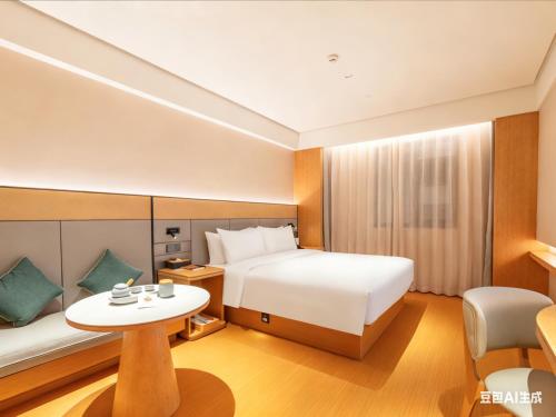 Ένα ή περισσότερα κρεβάτια σε δωμάτιο στο JI Hotel Beijing Changping Future Science City