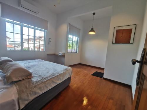 a bedroom with a bed and a door to a hallway at Room Only - RyuiBungalow 23'00-11'00 - Night Use - PROMO in Sungai Petani