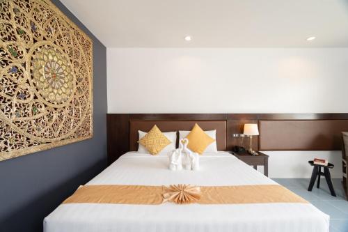 Postel nebo postele na pokoji v ubytování Blue Beach Grand Resort And Spa