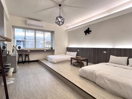 Postel nebo postele na pokoji v ubytování 客梢 Cushare #市政府商務住宿 #停車方便 #可包棟