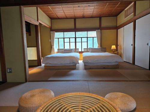 Ένα ή περισσότερα κρεβάτια σε δωμάτιο στο 阡陌senpakuせんぱく