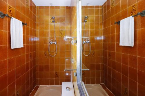 a bathroom with a shower with a toilet and a sink at Villa COCOCHA in Salou