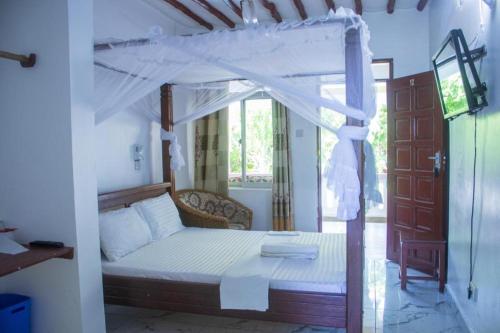 Ένα ή περισσότερα κρεβάτια σε δωμάτιο στο Manyatta Hotels & Apartments