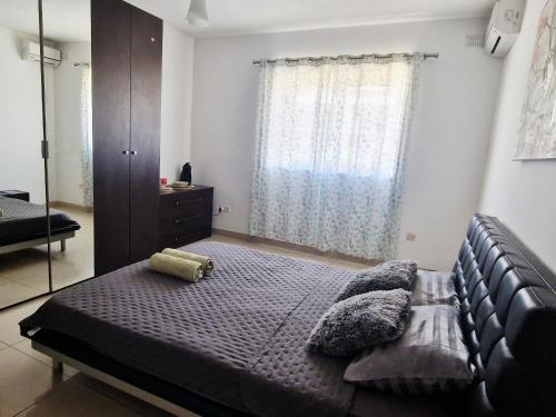 Ένα ή περισσότερα κρεβάτια σε δωμάτιο στο Welcome to Malta